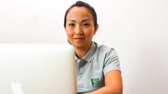 woman working on a MacBook
