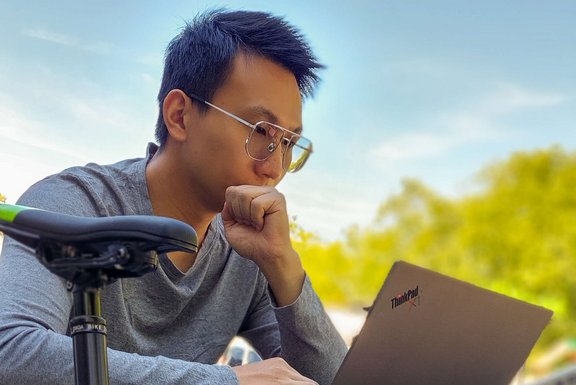 working outside on a notebook
